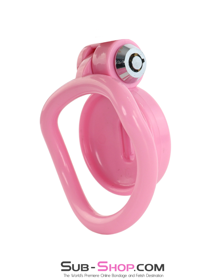 Side angle of pink chastity cage showing smooth plastic finish and locking housing.