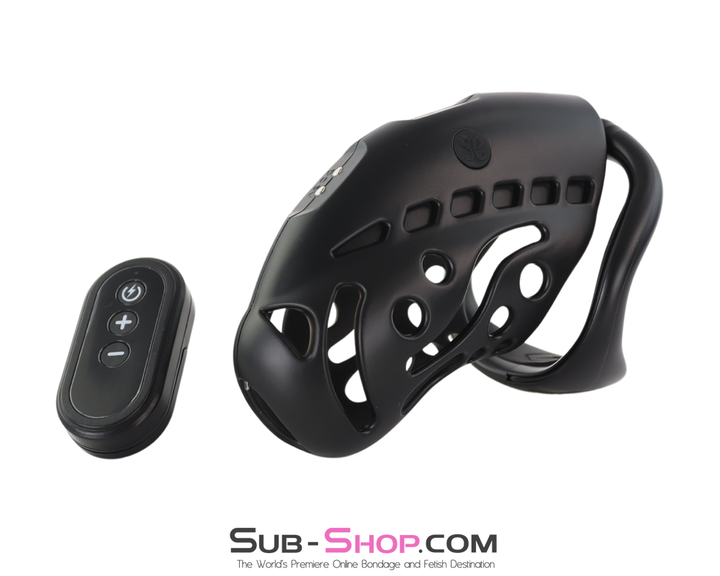 Side angle view of the matte black chastity cage alongside the remote controller.