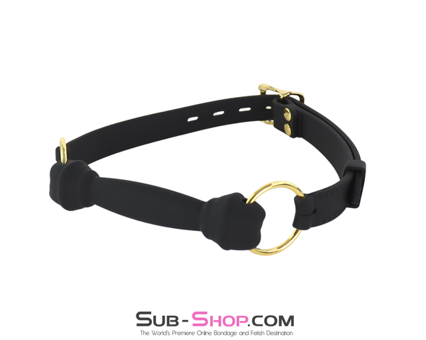 Black silicone bone gag with gold rings and adjustable strap displayed on white background.
