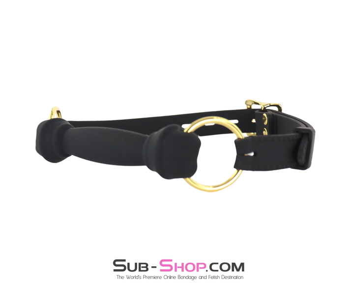 Angled view of bone gag showing hardware and strap layout.