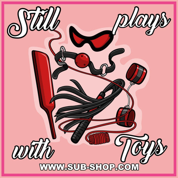 0843A      Still Plays With Toys Sticker Sticker   , Sub-Shop.com Bondage and Fetish Superstore